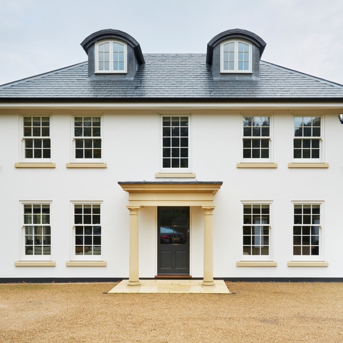 Property with shaped French windows to dormers and a casement window feature bay